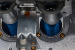 10 Things to Consider When Buying a New Furnace. Close up photo of a gas furnace flame burner.